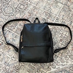 Leather backpack by Coolcy